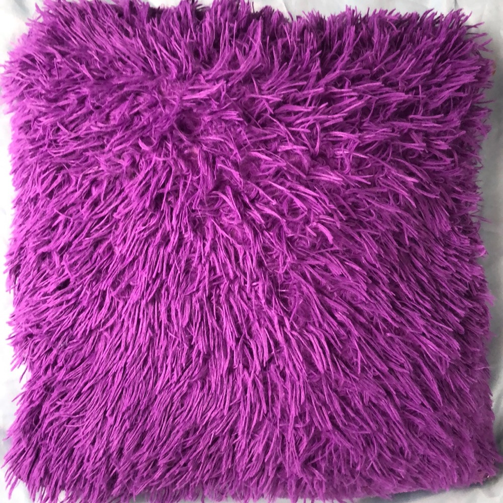 Fluffy purple & white pillow.